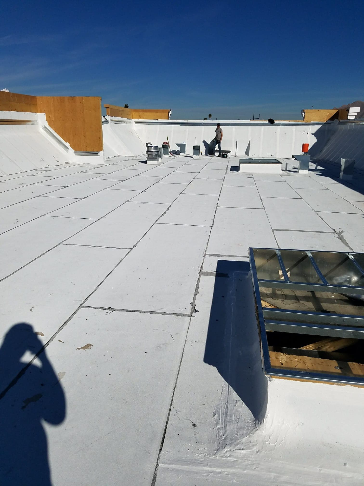 Fresh white reflective coating on a Continental Hills flat-roof Santa Fe home in Green Valley